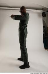 ERIC STANDING POSE WITH GUNS